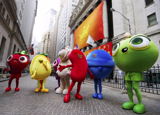 Mascots dressed as characters from the mobile video game "Candy Crush Saga" pose outside the New York Stock Exchange.