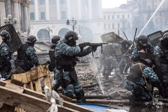 Berkut riot police shoot rubber bullets toward anti-government protesters on Independence Square on February 19, 2014 in Kiev, Ukraine. After several weeks of calm, violence has again flared between anti-government protesters and police as the Ukrainian parliament is meant to take up the question of whether to revert to the country's 2004 constitution.