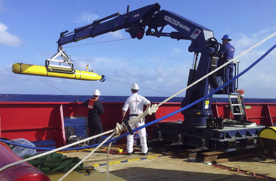 Image: The Bluefin 21 is hoisted back on board the Australian Defence Vessel Ocean Shield