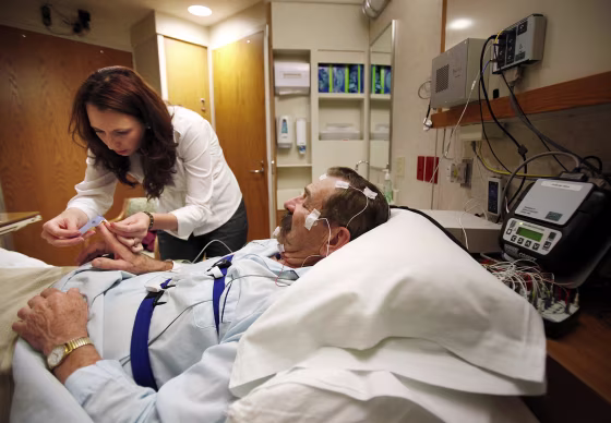 Image: Amanda Rasmuson prepares Chisholm for an overnight sleep evaluation for a sleep study at UW Hospital's Clinics in Madison, Wis.