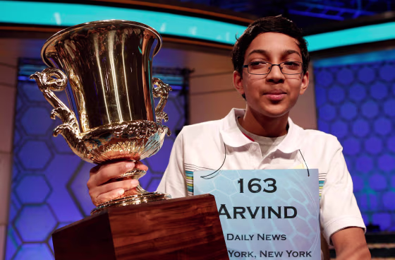 Image: Arvind Mahankali of New York holds his trophy after winning the National Spelling Bee at National Harbor in Maryland