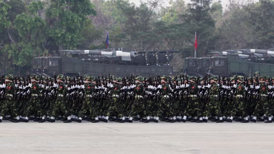 Image: Soldiers march during a parade to mark the 69th Armed Forces Day in Myanmar's capital Naypyitaw
