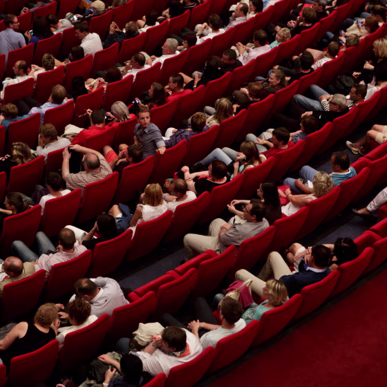 Audience members wait for a screening at a film festival.