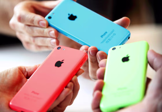 Image: People hold iPhones