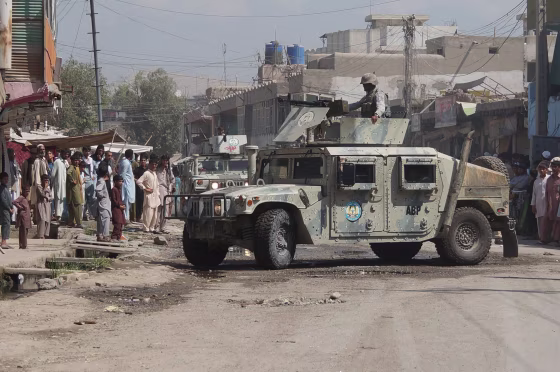 Afghan security forces inspect the site of a suicide attack in Jalalabad, east of Kabul, Afghanistan, Saturday.