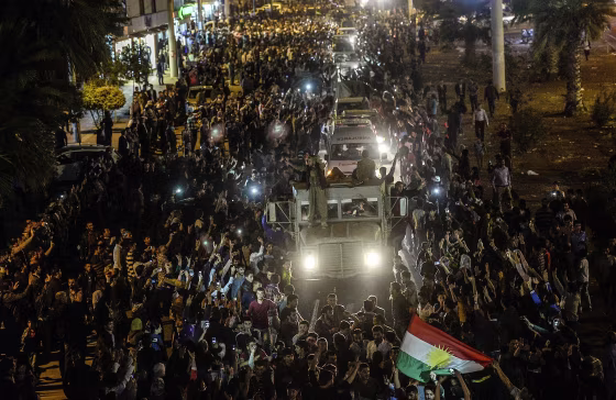 Image: Kurds in Turkey greet peshmerga convoys at Viransehir, in Sanliurfa