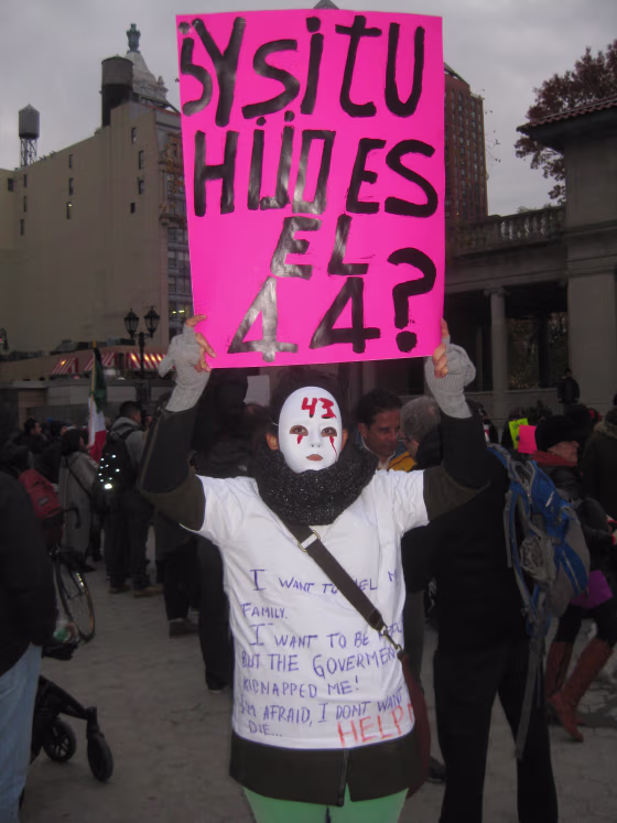 Fathers, mothers, children, activists and others gathered for a vigil in New York City on Sunday, Nov. 16 to demand justice for the 43 students from Guerrero, Mexico who disappeared over 7 weeks ago.