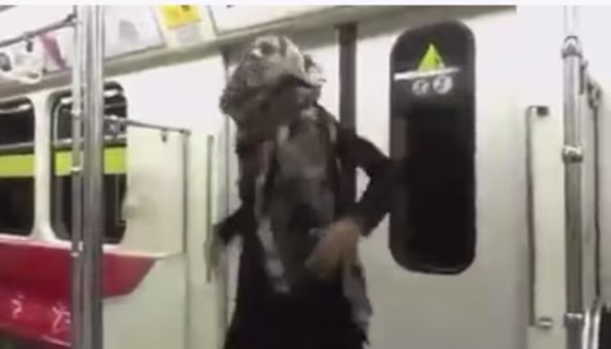 Image: Woman dancing in Tehran subway