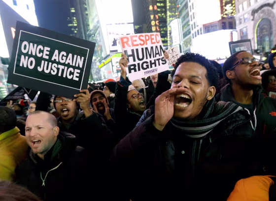 Image: Protesters shout at Times Square after it was announced that the New York City police officer involved in the death of Eric Garner is not being indicted,