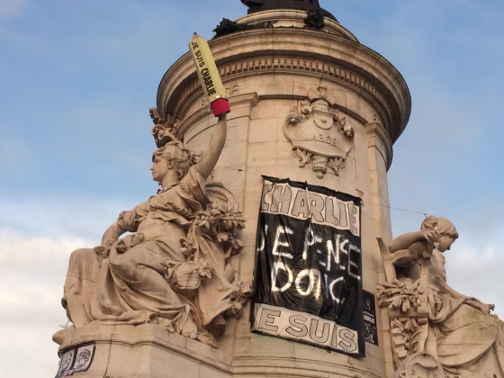 The statue representing "Liberty" holds a pencil aloft bearing the "I am Charlie" motto at the Place de la Republique in Paris early on January 13. The plaza has been the centerpoint of rallies expressing solidarity with the victims of the massacre at the offices of the satirical newspaper Charlie Hebdo and pencils and pens have been used as a defiant symbol of support for freedom of speech.