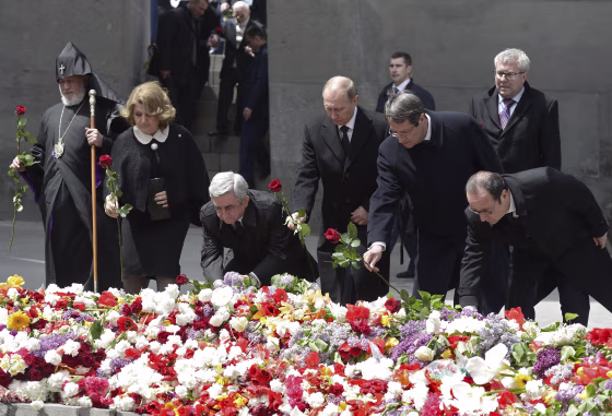 Image: Officials lay flowers during a commemoration ceremony marking the centenary of the mass killing of Armenians by Ottoman Turks in Yerevan