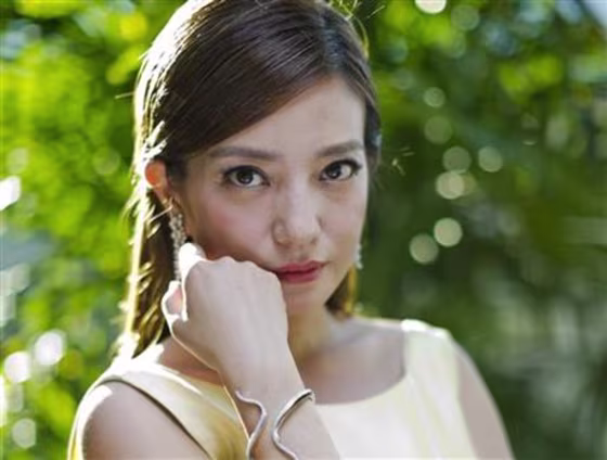 In this photo taken Thursday, Aug. 28, 2014, Chinese actress Zhao Wei poses for portraits during the 71st edition of the Venice Film Festival in Venice, Italy. New rules enacted May 1, 2015 making it easier to file lawsuits in China have led to a new