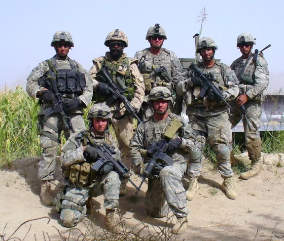 This is a photo of Lt.Col. Harjit Singh Sajjan of the Canadian army in a group with U.S. soldiers before they embarked on a strategic mission. He was deployed to Afghanistan thrice, the third time at the request of Gen.James Terry of the U.S. army, who was the commander of the 10th Mountain Division stationed in Afghanistan at that time. Col.Sajjan served as "Special Adviser" to Gen.Terry. He was a vital part of some strategic missions carried out by the U.S. army in Kandahar, and other areas heavily controlled by the Taliban. In addition to serving as "Special Adviser" to Gen.James Terry, he also served as Special Adviser to another U.S. govt. representative in Kandahar.