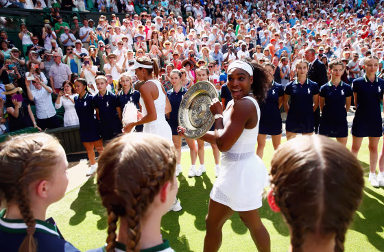 Image: Serena Williams leaves court with the Venus Rosewater Dish after her victory
