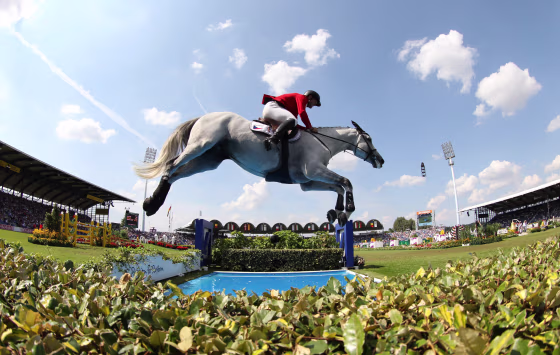 Image: Ondrej Zvara of Czech Republic jumps with his horse Cento Lano over an obstacle