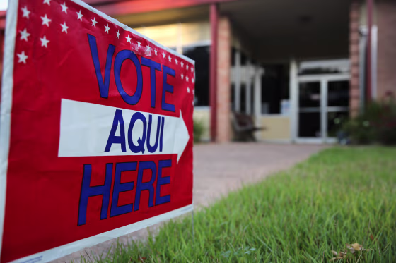 Image: English-Spanish Signs Front Election Center In Texas