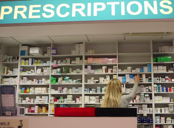 pharmacist stocks shelves