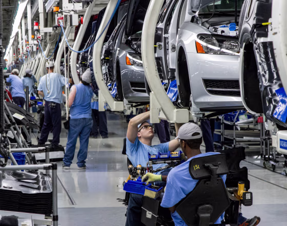 Workers assemble Volkswagen Passat sedans