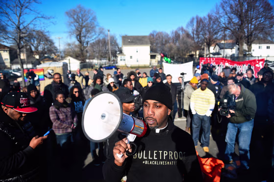 Image: Danny Givens Jr. of St. Paul, Minnesota speaks to a gathering crowd of the group Black Lives Matter before they march to city hall during a protest in Minneapolis, Minnesota