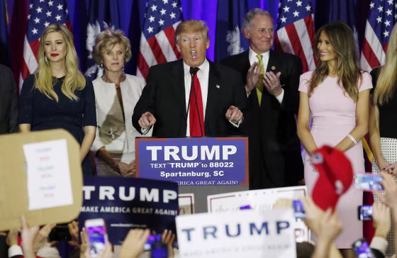 Image: Republican U.S. presidential candidate Donald Trump speaks with his daughter Ivanka and his wife Melania at his sides at his 2016 South Carolina presidential primary night victory rally in Spartanburg