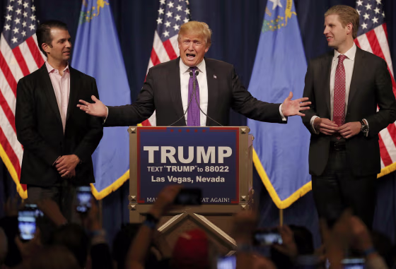 Image: Republican U.S. presidential candidate Donald Trump is flanked by his sons Donald Jr. and Eric as he addresses supporters after being declared by the television networks as the winner of the Nevada Repulican caucuses at