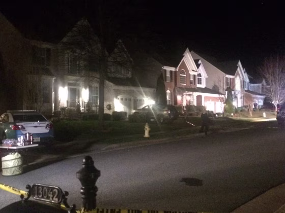 Police remain on the scene late Saturday, Feb. 27, 2016, on Lashmere Court in Dale City, Va., where three Prince William County police officers were shot responding to a domestic violence call.