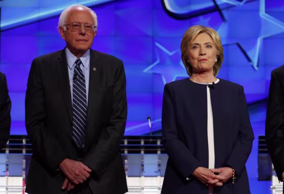 Image: Democratic presidential candidate Senator Bernie Sanders and former Secretary of State Hillary Clinton stand together before the start of the first official Democratic candidates debate of the 2016 presidential campaign in Las Vegas