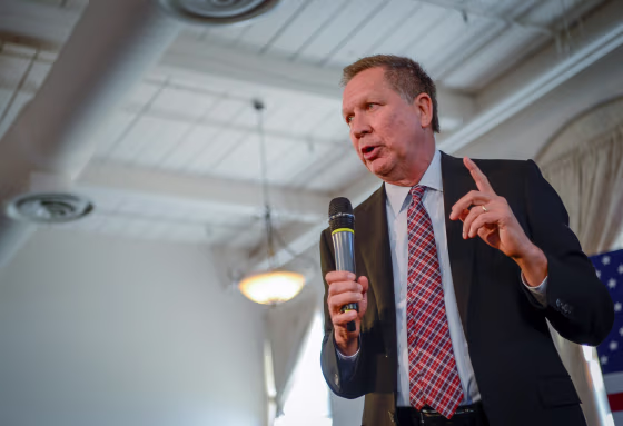 Image: U.S. Republican presidential candidate, Ohio Gov. John Kasich, addresses a packed room at a town hall meeting in Savage, Maryland