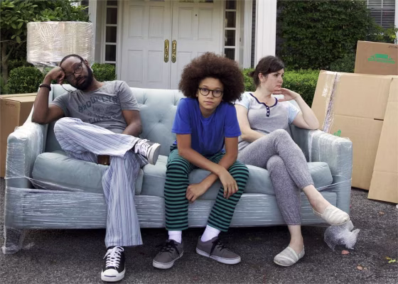 Neslan Ellis as Mack Burns, Armani Jackson as Clark Burns, and Melanie Lynskey as Gina McNulty-Burns in LITTLE BOXES.