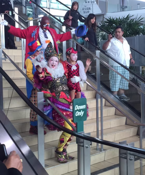 Fern Street Circus performers entertain travelers at the San Diego International Airport.