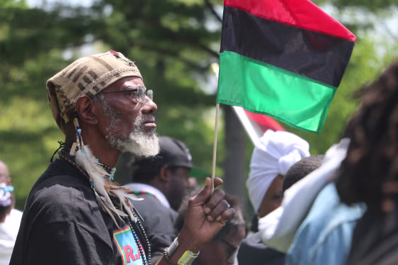 A veteran who calls himself The Nu World Warrior watches an annual ceremony honoring Malcolm X on what would be his 91st birthday.
