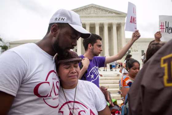 Rosario Reyes, an undocumented mother from El Salvador, reacts to news on a Supreme Court decision on immigration.