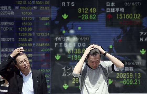 Image: Electronic stock board at Tokyo securities firm