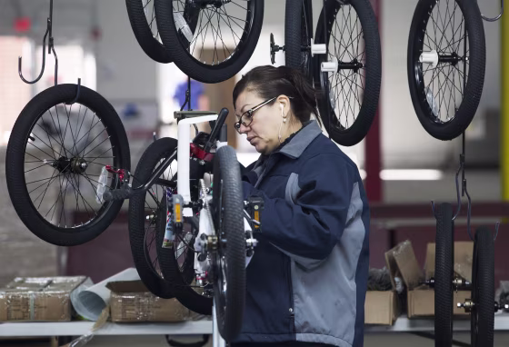 Nancy Bocanegra of Sumter, South Carolina installs brake cables at the new Bicycle Corporation of America plant in Manning, South Carolina