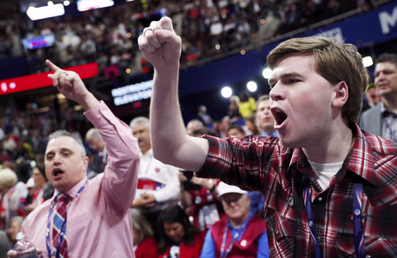 Image: Convention delegates yell and scream as the Republican National Convention descended into chaos over the announcement that the convention would not hold a roll-call vote in Cleveland