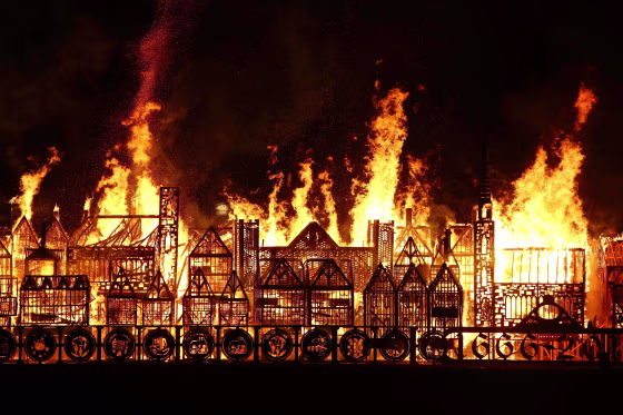 Image: A 120-meter long model of the 17th century London skyline is set alight on the River Thames to commemorate the 1666 Great Fire of London in London