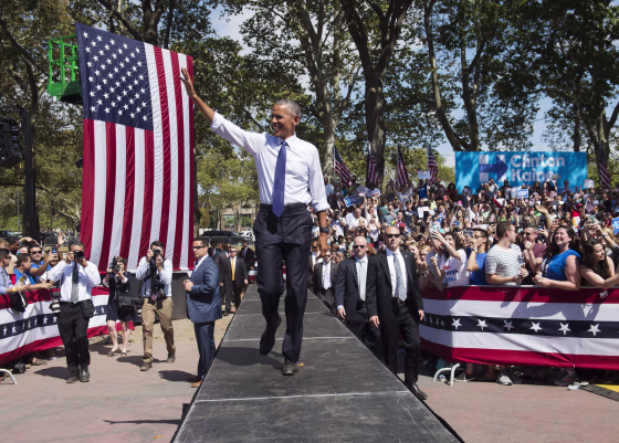 Image: Obama arrives at a Hillary Clinton rally
