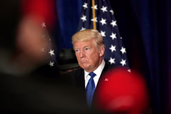 Image: Republican presidential nominee Donald Trump reacts as reporters yell questions to him after he stated that he believes U.S. President Barack Obama was born in the United States in Washington