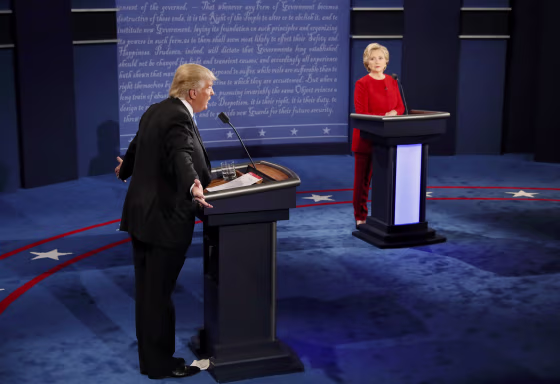 Image: Republican U.S. presidential nominee Trump speaks as Clinton listens during presidential debate at Hofstra University in Hempstead