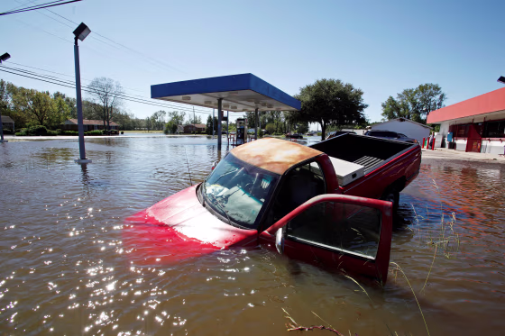 Image: An abandoned truck lies in submerged waters after Hurricane Matthew hit Lumberton, North Carolina