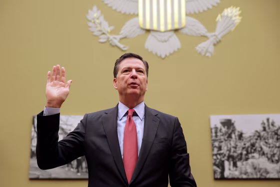 Image: FBI Director Comey is sworn in before testifying before a House Judiciary Committee hearing on \"Oversight of the Federal Bureau of Investigation\" on Capitol Hill in Washington