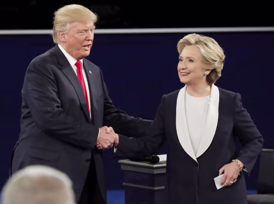 Image: Republican U.S. presidential nominee Donald Trump and Democratic U.S. presidential nominee Hillary Clinton shake hands at the end of their presidential town hall debate at Washington University in St. Louis