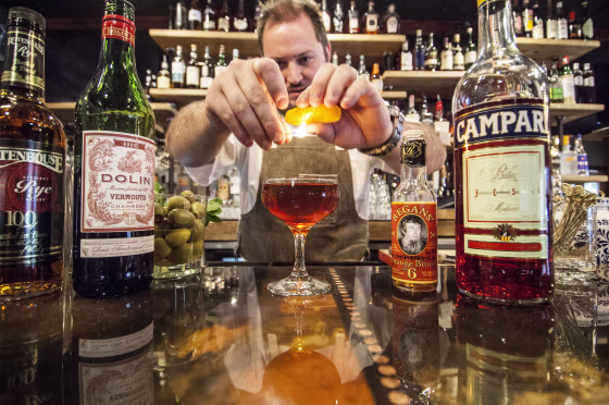 Clayton Rollison mixes a drink. Photo by Michael Hrizuk Photos.