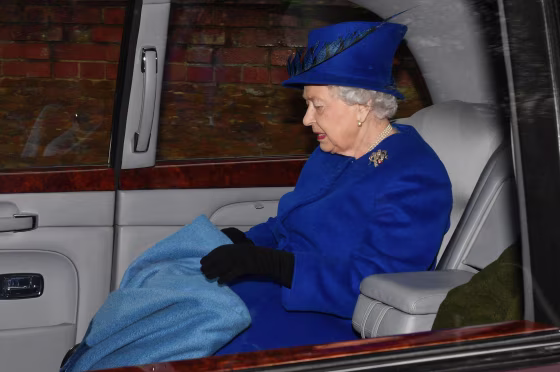 Image: The queen was driven to church, carrying a blanket to keep warm.