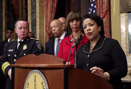 Image: Attorney General Loretta Lynch, right, speaks during a joint news conference in Baltimore on Jan. 12. to announce the Baltimore Police Department's commitment to a sweeping overhaul of its practices under a court-enforceable agreement with the fede
