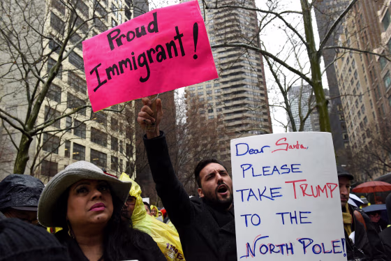 Image: People protest before marching to Trump Tower during a demonstration organized by the New York Immigration Coalition against President-elect Donald Trump in the Manhattan borough of  New York