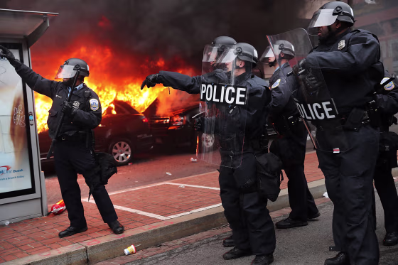 Image: Police and demonstrators clash in downtown Washington, D.C. after a limo was set on fire following the inauguration of President Donald Trump on Jan. 20.