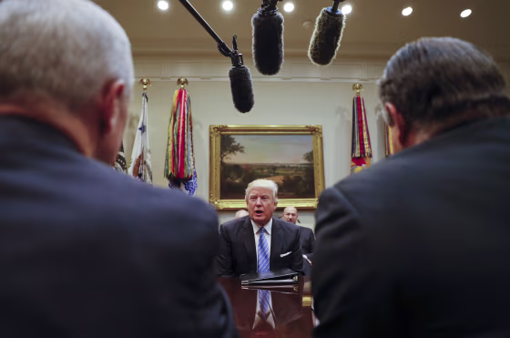 Image: Trump speaks while hosting a breakfast with business leaders