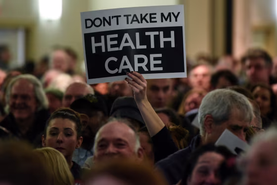 Image: People demonstrate for the Affordable Care Act and against Trump during the First Stand Rally in Newark