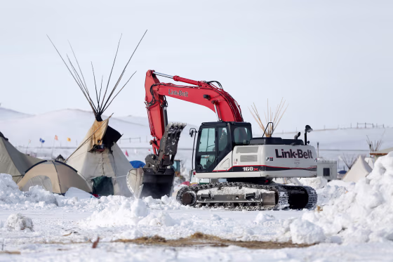 Image: Crews remove waste from the opposition camp against the Dakota Access oil pipeline near Cannon Ball